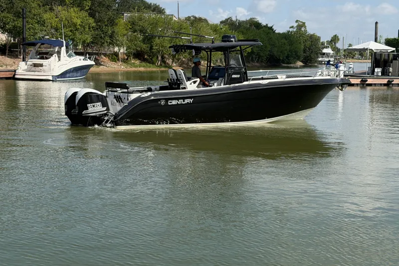 Slide: The Image of 2009 Century 3200 Center Console boat on calm water with Yamaha engines. - 5