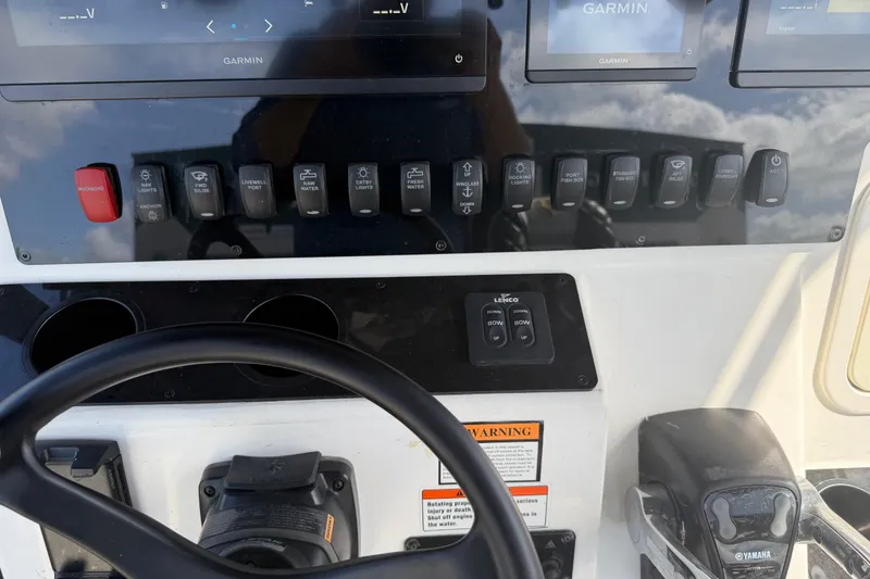 Slide: The Image of Century 3200 Center Console 2009 dashboard with Garmin displays and Yamaha controls. - 31
