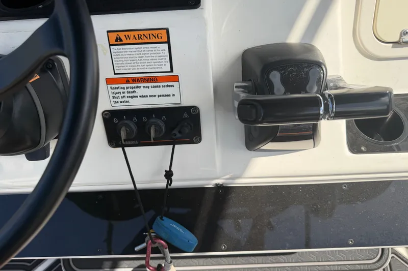 Slide: The Image of Control panel of a 2009 Century 3200 Center Console boat with warning labels. - 34