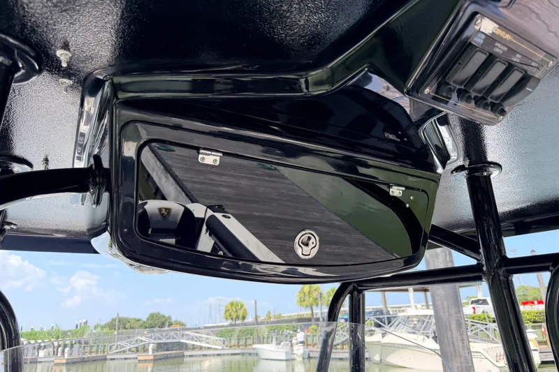 Slide: The Image of 2009 Century 3200 Center Console boat's overhead storage and control panel. - 50