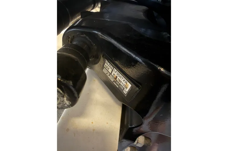 Slide: The Image of Close-up of a Yamaha engine part on a 2009 Century 3200 Center Console boat. - 60