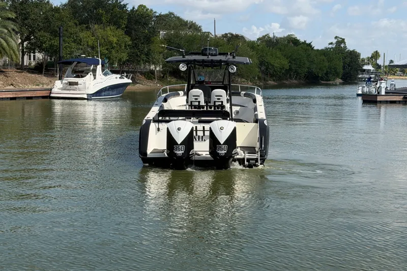Slide: The Image of 2009 Century 3200 Center Console boat cruising on a calm river. - 4