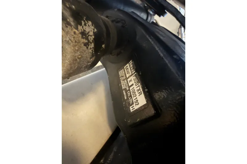 Slide: The Image of Close-up of a Yamaha engine part on a 2009 Century 3200 Center Console boat. - 59