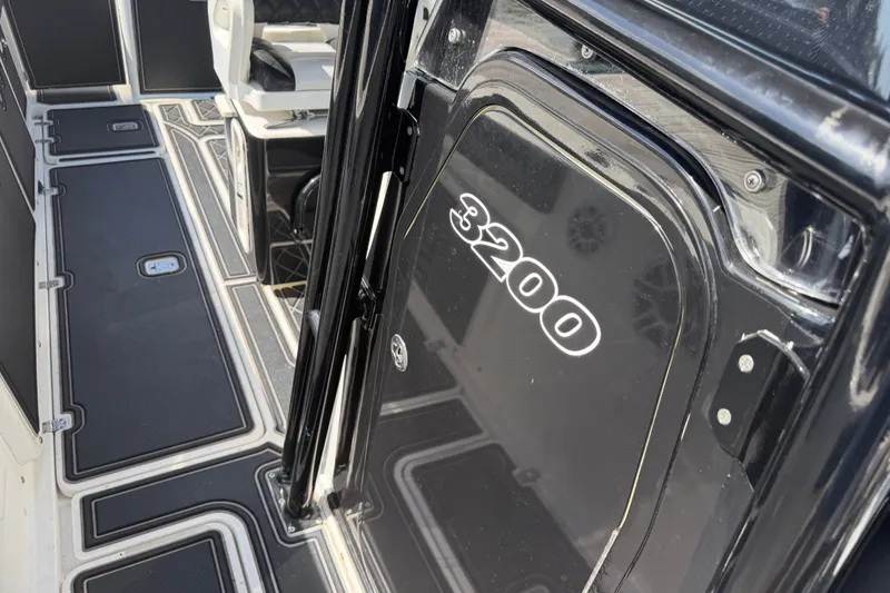 Slide: The Image of 2009 Century 3200 Center Console boat interior with sleek black and white design. - 22