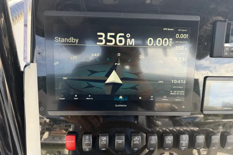Slide: The Image of Garmin navigation display on a 2009 Century 3200 Center Console boat dashboard. - 30