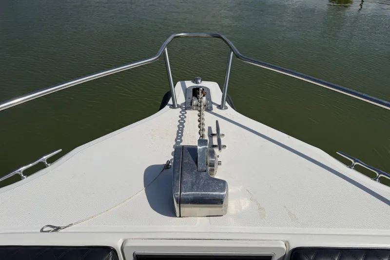 Slide: The Image of Bow of a 2009 Century 3200 Center Console boat with anchor chain and railing. - 15