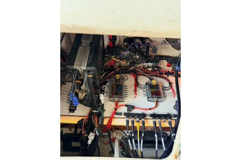 Slide: The Image of Electrical wiring and components inside a 2009 Century 3200 Center Console boat. - 57