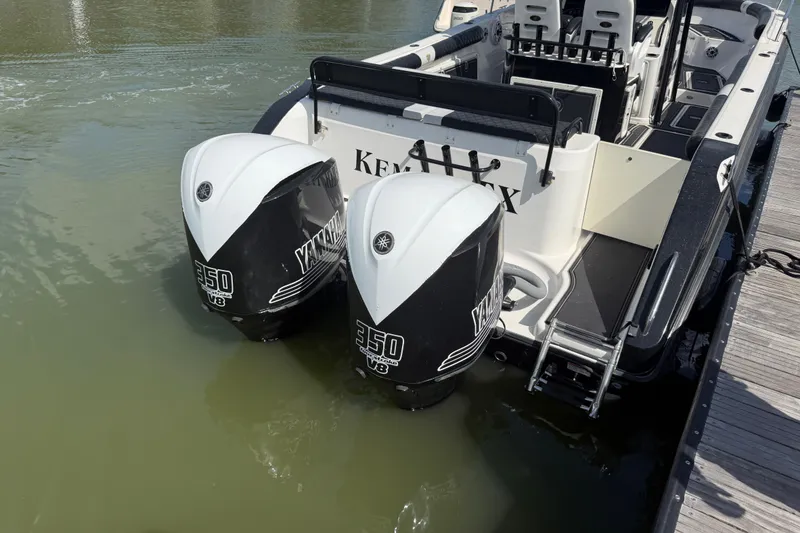 Slide: The Image of 2009 Century 3200 Center Console boat with twin Yamaha 350 V8 engines docked. - 39