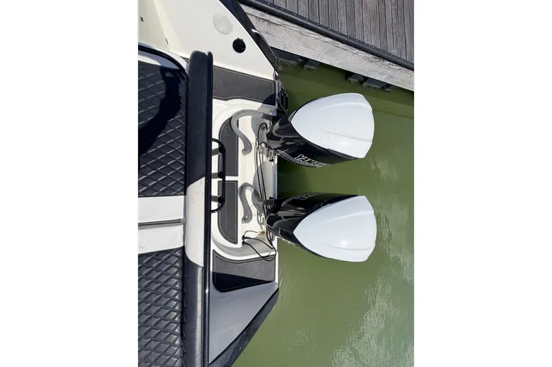 Slide: The Image of Overhead view of 2009 Century 3200 Center Console boat engines at dock. - 55