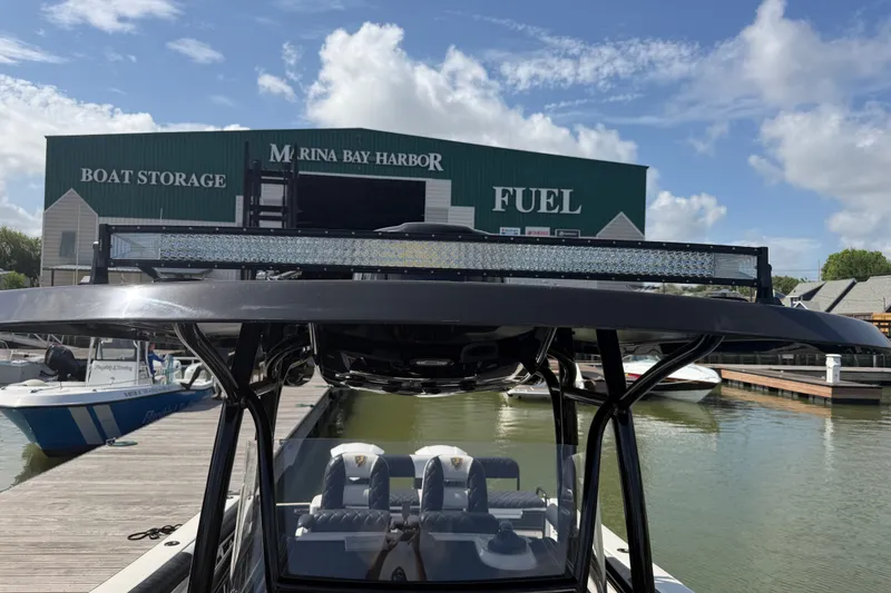 Slide: The Image of 2009 Century 3200 Center Console boat docked at Marina Bay Harbor. - 18