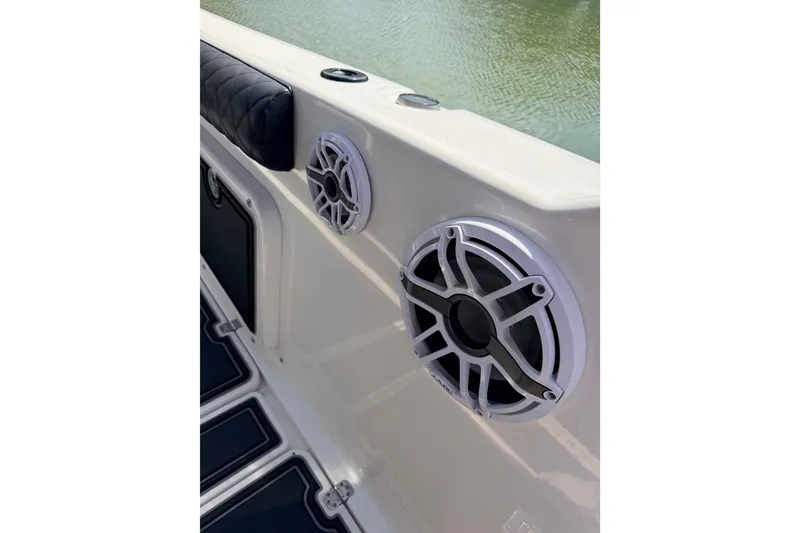 Slide: The Image of Speaker system on a 2009 Century 3200 Center Console boat, near water. - 52