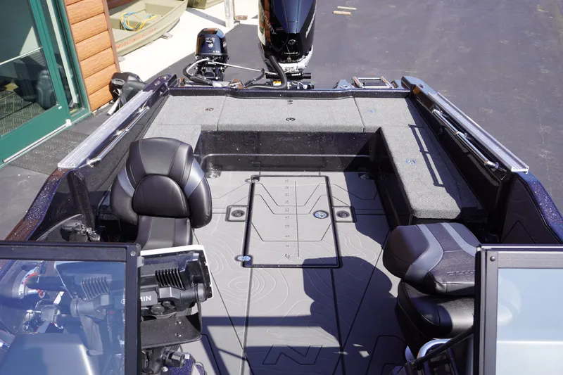 Slide: The Image of Interior view of a 2027 Nitro ZV21 Pro boat, featuring seating and deck layout. - 16