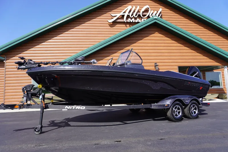 The Image of 2027 Nitro ZV21 Pro boat on trailer outside All Out Marine building. - 0