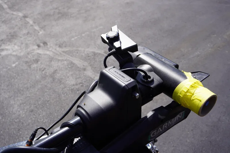 Slide: The Image of Handlebars of a 2027 Nitro ZV21 Pro scooter with yellow tape and mounted device. - 23