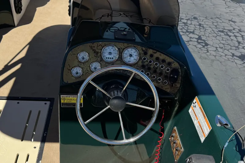 Slide: The Image of Steering console of a 2019 Razor 258 pf boat with gauges and controls. - 30