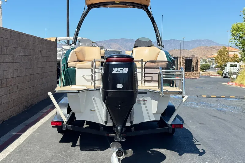 Slide: The Image of 2019 Razor 258 pf boat with powerful 250 engine, parked outdoors. - 4