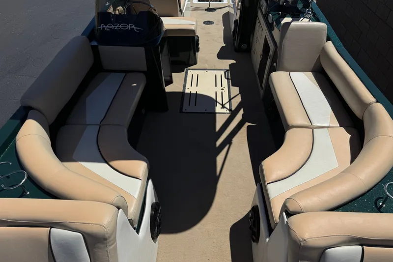 Slide: The Image of Interior of a 2019 Razor 258 pf boat with beige seating. - 13