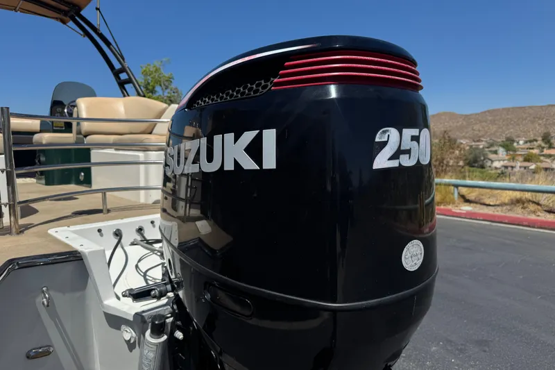 Slide: The Image of Boat with Suzuki 250 outboard motor, Razor 258 pf model, 2019, parked outdoors. - 7