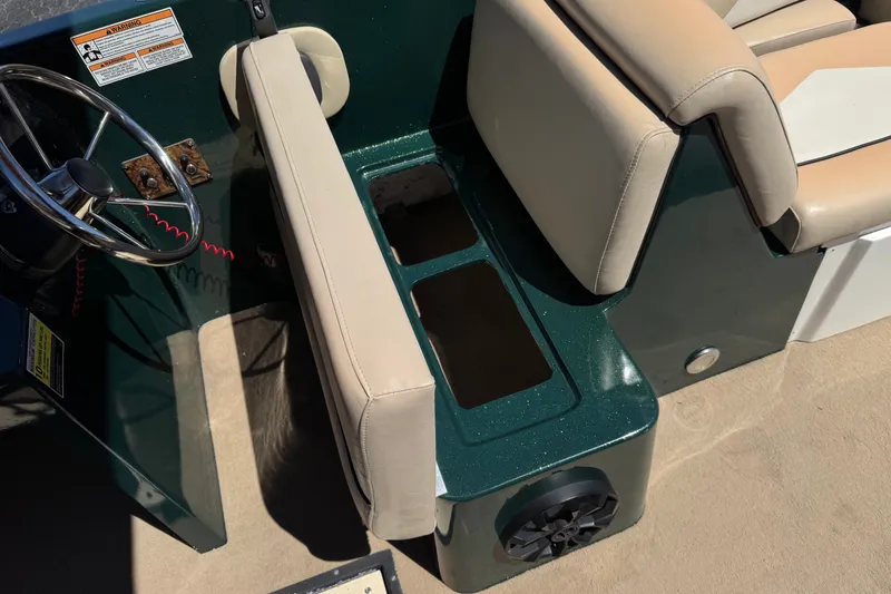 Slide: The Image of Boat interior with beige seating and steering wheel, Razor 258 pf, 2019 model. - 31