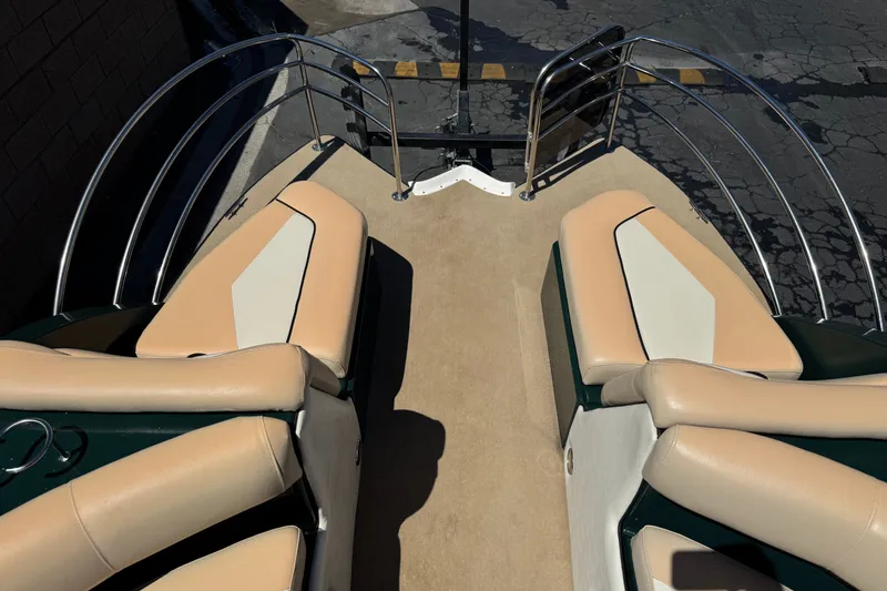 Slide: The Image of 2019 Razor 258 pf boat interior with beige seating and metal railings. - 14