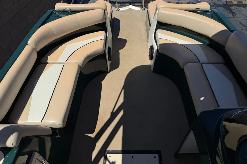 Slide: The Image of Interior of a 2019 Razor 258 pf boat with beige and white seating. - 15