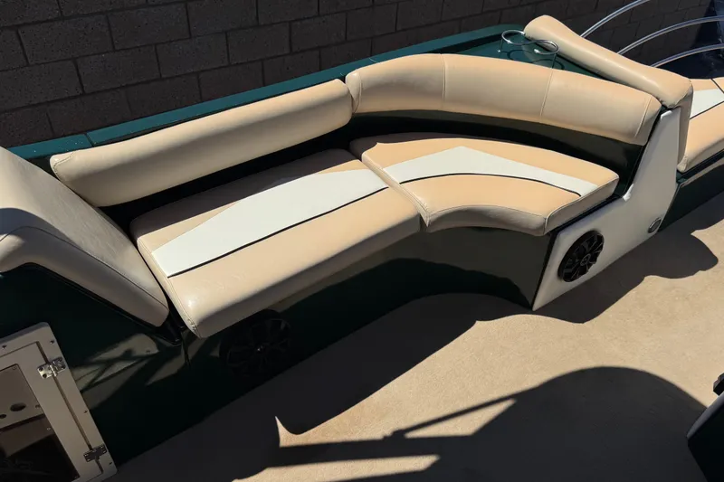 Slide: The Image of Luxurious seating on a 2019 Razor 258 pf boat, featuring beige and white upholstery. - 16