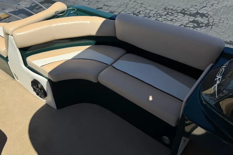 Slide: The Image of Luxurious seating on a 2019 Razor 258 pf boat, featuring beige and white upholstery. - 18