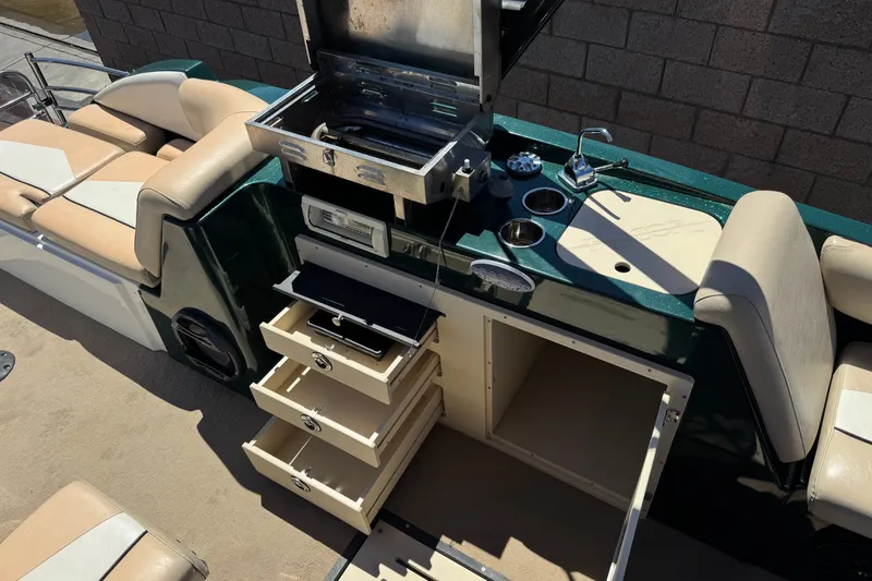 Slide: The Image of Luxury boat interior with grill, storage drawers, and seating, Razor 258 pf, 2019 model. - 22