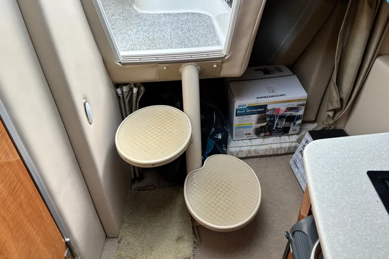 Slide: The Image of Interior of 2003 Maxum 2500 SCR boat with steps and storage box. - 15