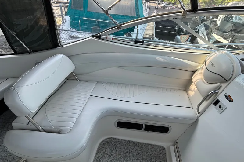 Slide: The Image of 2003 Maxum 2500 SCR boat interior with white seating and modern design. - 4