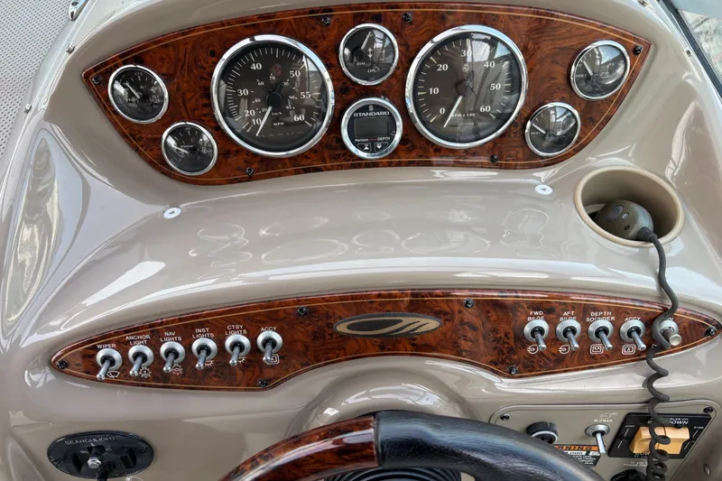 Slide: The Image of Dashboard of a 2003 Maxum 2500 SCR boat with gauges and controls. - 7