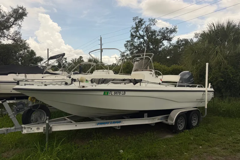 The Image of 2000 Polar 2100 Center Console boat on trailer, parked outdoors. - 0