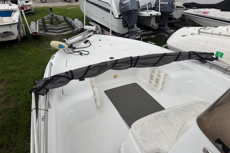 Slide: The Image of 2000 Polar 2100 Center Console boat interior with fishing rod holders and seating. - 16