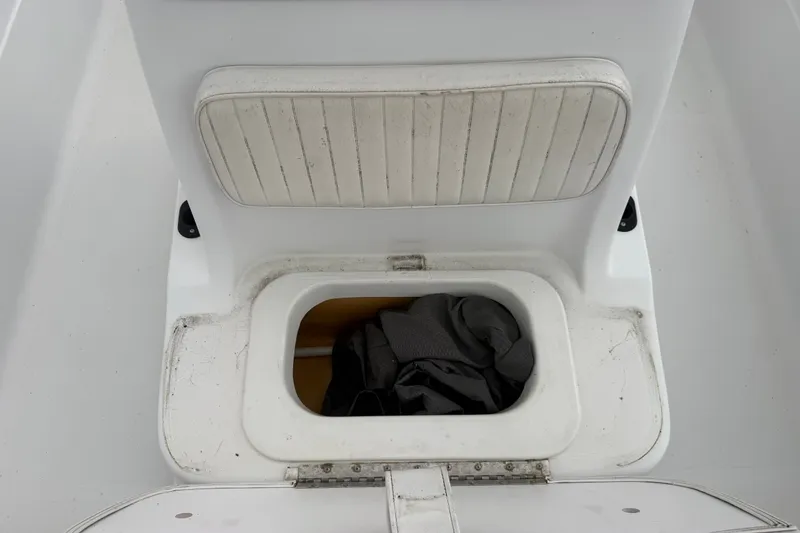 Slide: The Image of Storage compartment on a 2000 Polar 2100 Center Console boat with seat cushion. - 17