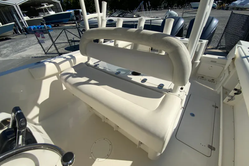 Slide: The Image of 2014 Sailfish 290 CC boat interior with seating and controls. - 19