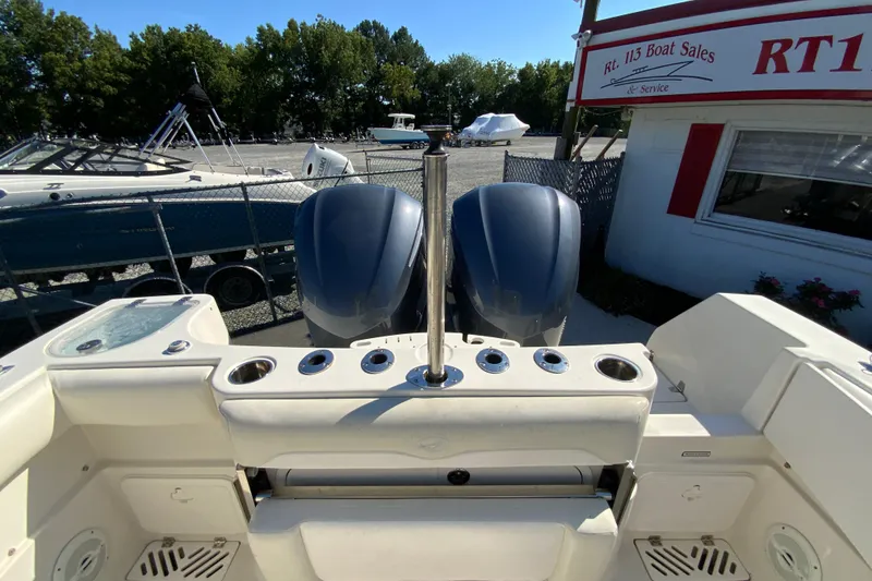 Slide: The Image of 2014 Sailfish 290 CC boat with dual engines at a boat sales lot. - 37