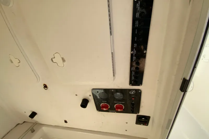 Slide: The Image of Control panel of a 2014 Sailfish 290 CC boat interior. - 32