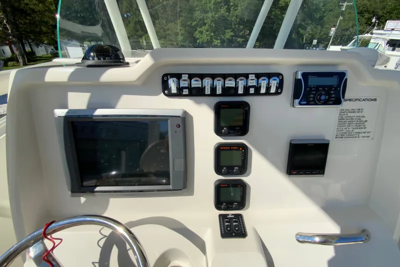 Slide: The Image of Helm of 2014 Sailfish 290 CC boat with navigation and control instruments. - 18