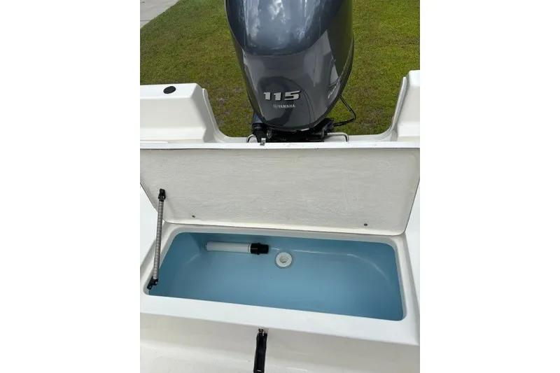 Slide: The Image of 2026 Bulls Bay 2000 boat with Yamaha 115 engine and open storage compartment. - 11