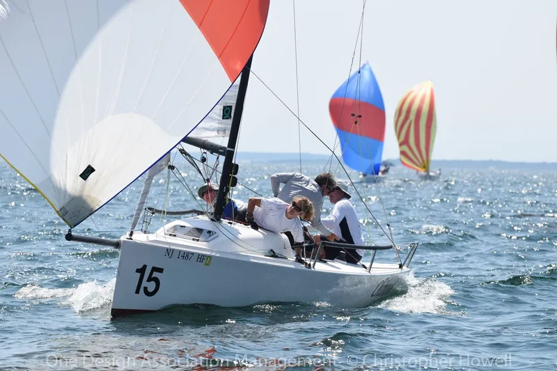 Slide: The Image of Sailing race featuring a 2013 J Boats J/70 with colorful spinnakers in the background. - 1