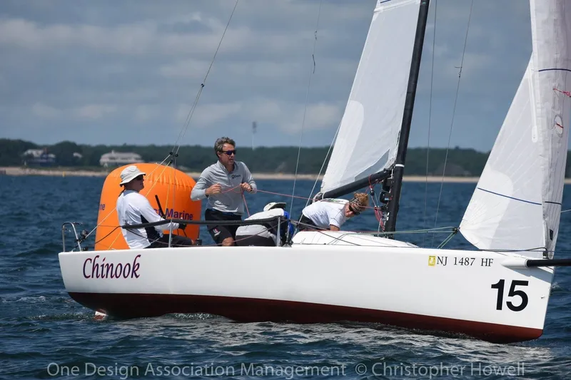 Slide: The Image of Sailing team on 2013 J Boats J/70 "Chinook" during a race, near orange buoy. - 11