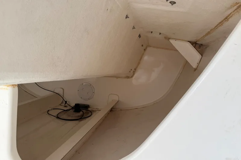 Slide: The Image of Interior view of a 2013 J Boats J/70 sailboat, showcasing storage space. - 9
