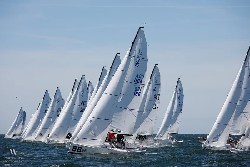 Slide: The Image of Fleet of 2013 J Boats J/70 sailboats racing on open water. - 19