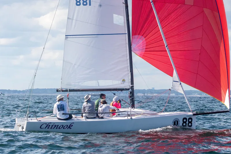 Slide: The Image of Sailing J/70 boat "Chinook" with red spinnaker on open water, 2013 model. - 15