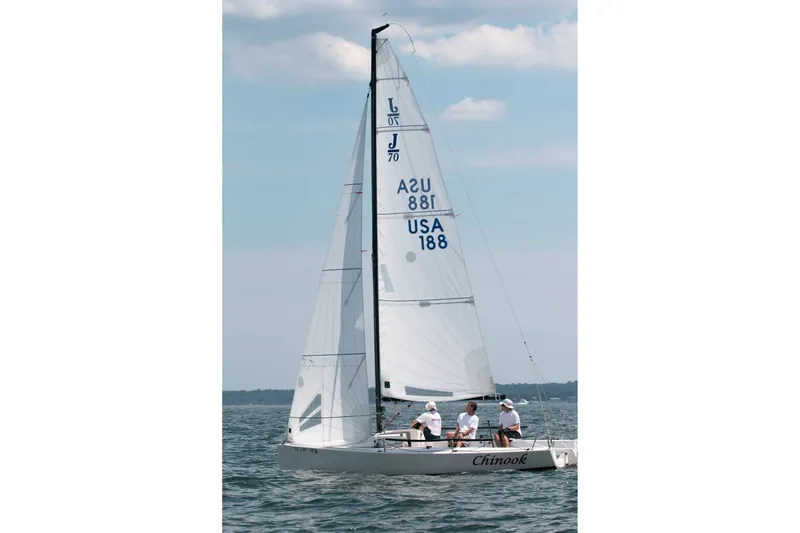 The Image of 2013 J Boats J/70 sailboat "Chinook" sailing on open water under a clear sky. - 13