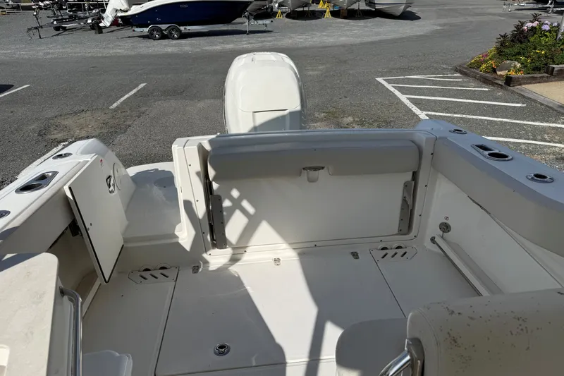Slide: The Image of 2018 Boston Whaler 230 Vantage boat interior with seating and storage compartments. - 9