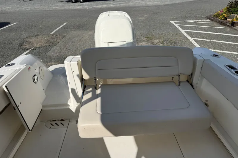 Slide: The Image of 2018 Boston Whaler 230 Vantage boat interior with seating and storage compartments. - 10
