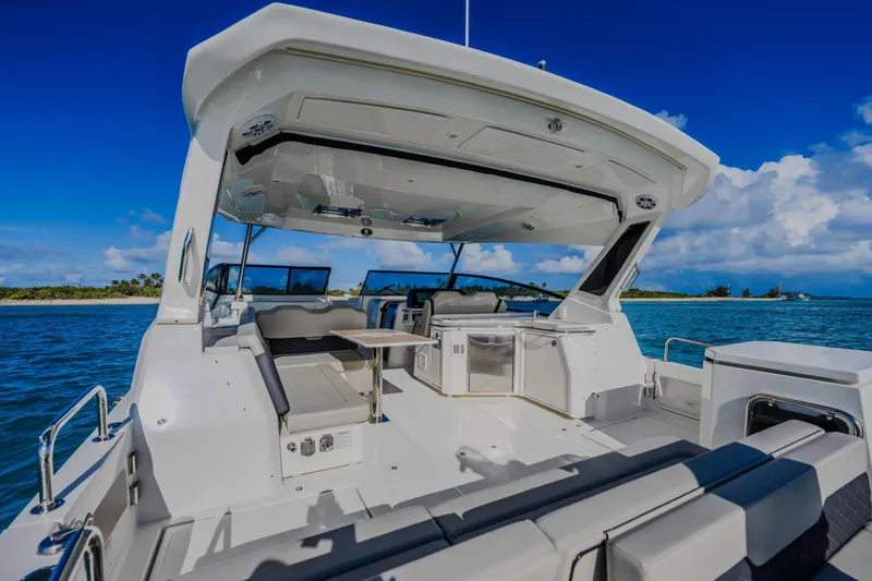Slide: The Image of 2023 Aquila 36 Sport boat interior with seating and ocean view. - 14