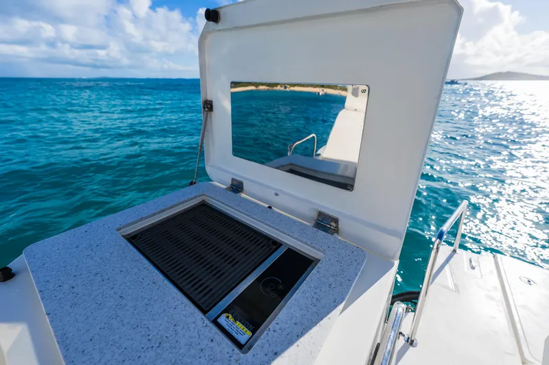 Slide: The Image of Outdoor grill on 2023 Aquila 36 Sport yacht with ocean view. - 23