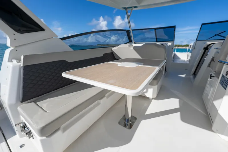 Slide: The Image of Interior of 2023 Aquila 36 Sport yacht with seating and table, ocean view. - 18